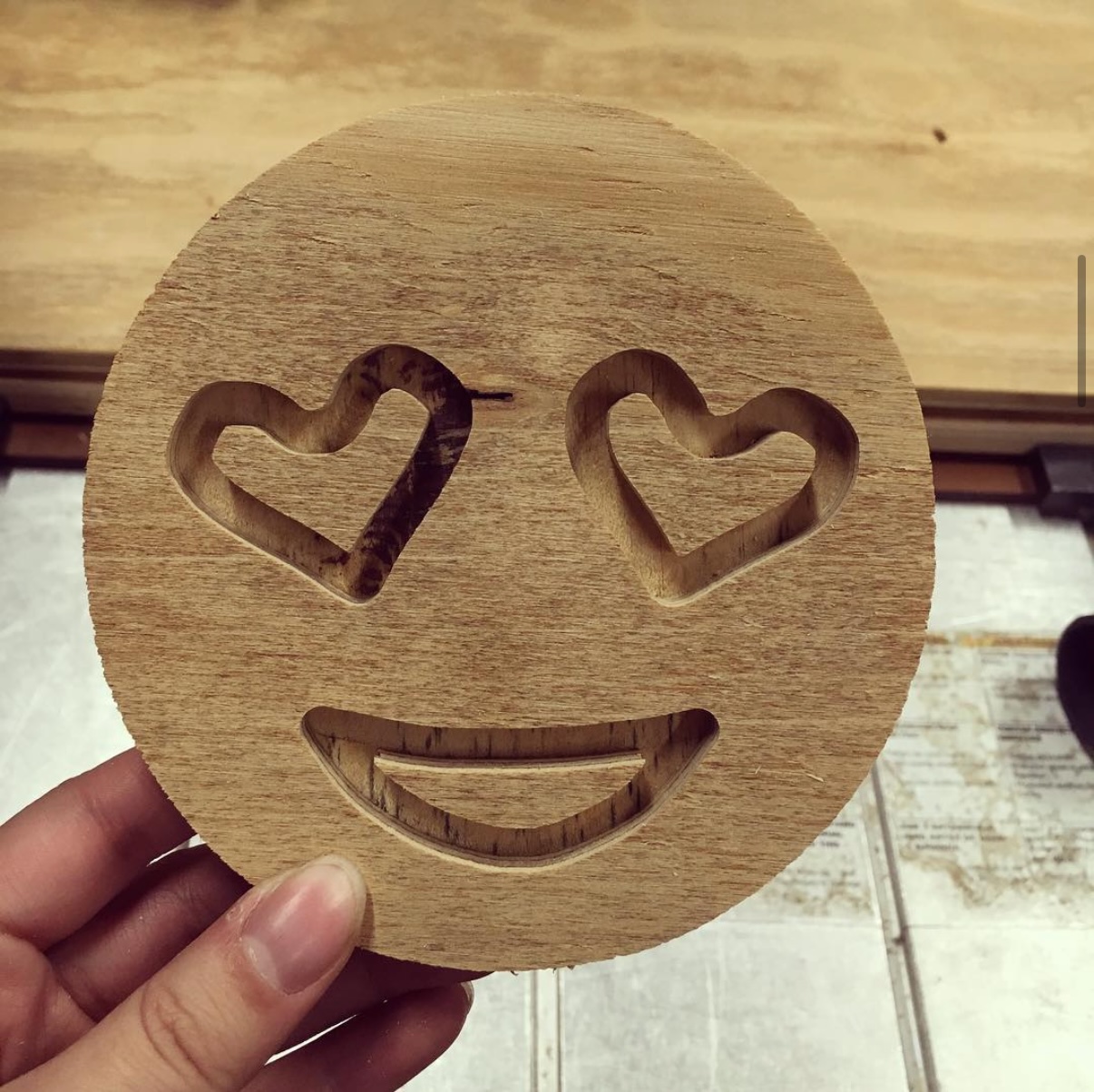 Carved wooden emoji
